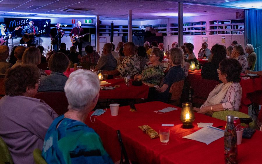 A full room enjoying a band at Music at the Hub