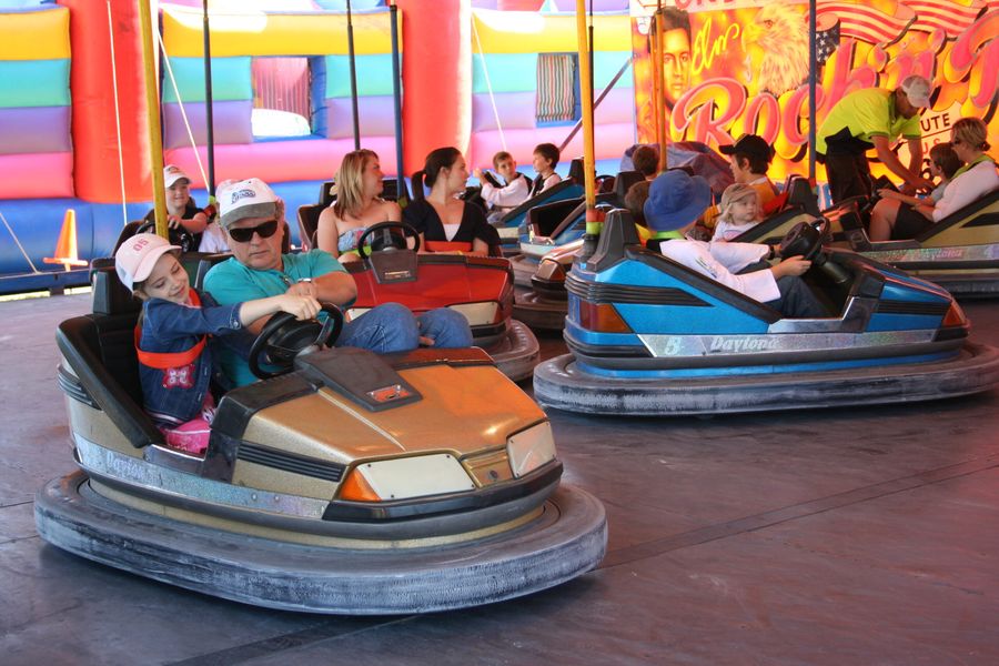 Families on dodgem cars at Centenary Rocks!